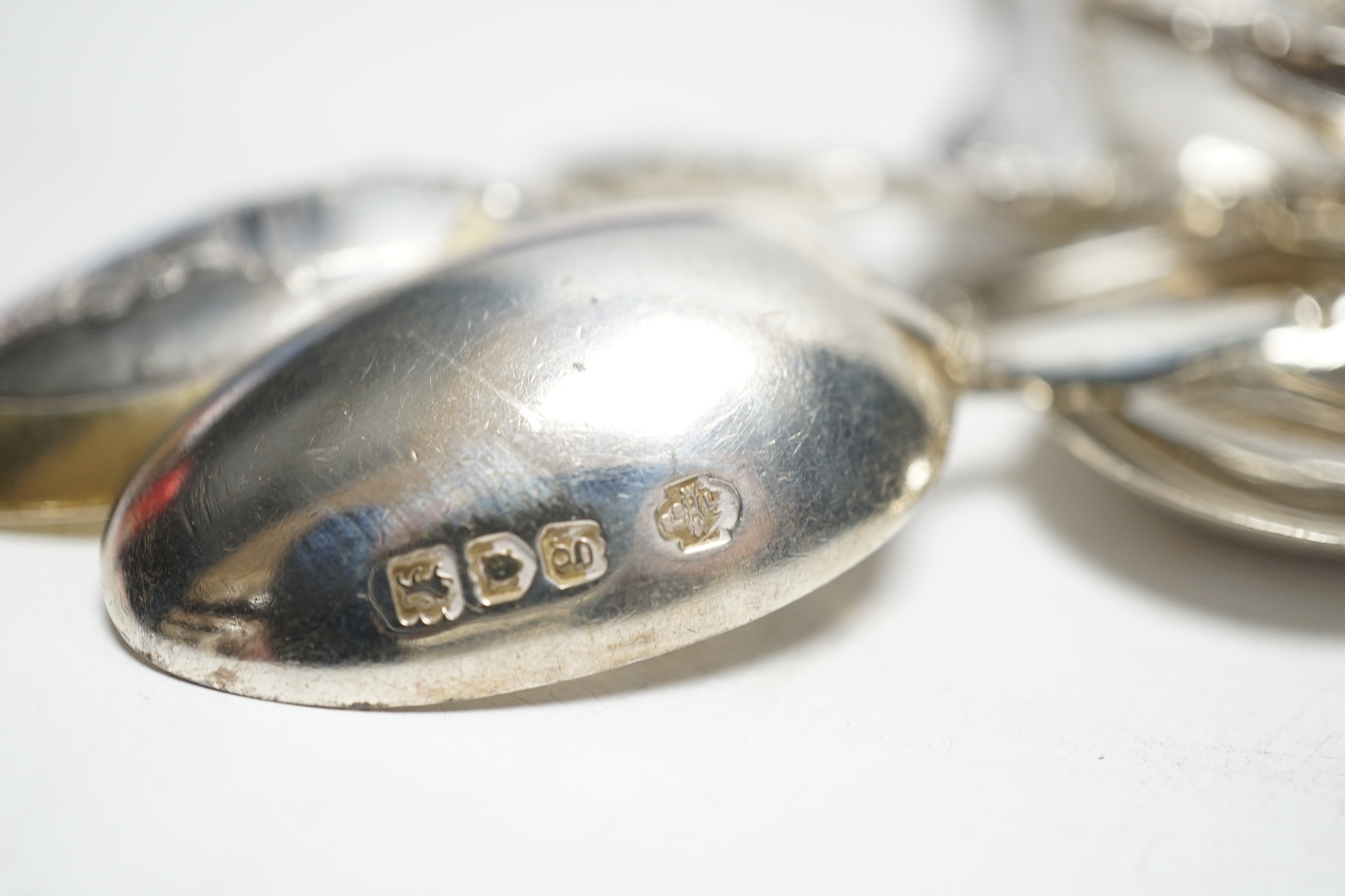 Sundry silver cutlery:- Two sets of six coffee spoons, a ‘’coronation’’ spoon, three souvenir spoons and a set of four apostle spoons.